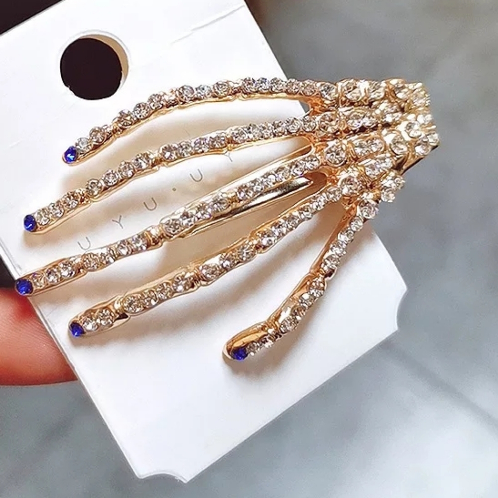 Blue fingertips hand hair clip